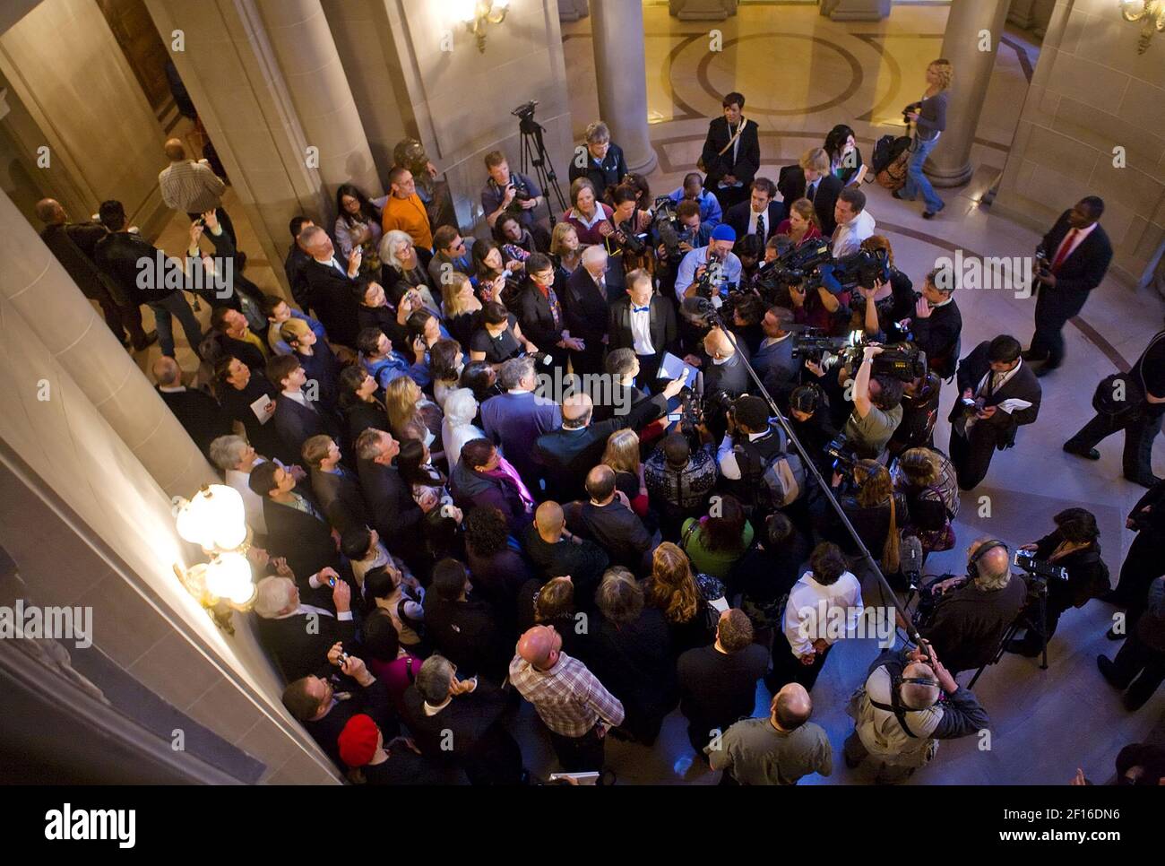 Media and family crowd around John Lewis and Stuart Gaffney, of San Francisco, as they are married inside the San Francisco City Hall, on the second day of legal gay marriages in California, Tuesday, June 17, 2008. The two were plaintiffs in the lawsuit that overturned the marriage ban. (Brian Baer/Sacramento Bee/MCT/Sipa USA) Stock Photo