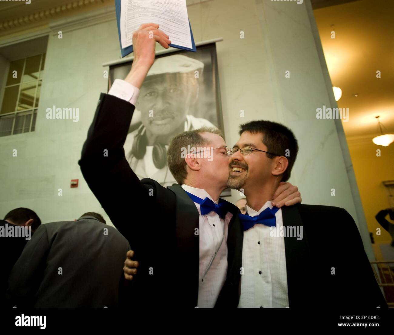 John Lewis, left, and Stuart Gaffney, of San Francisco, kiss as they hold up their marriage license inside the San Francisco City Hall, on the second day of legal gay marriages in California, Tuesday, June 17, 2008. The two were plaintiffs in the lawsuit that overturned the marriage ban. (Photo by Brian Baer/Sacramento Bee/MCT/Sipa USA) Stock Photo