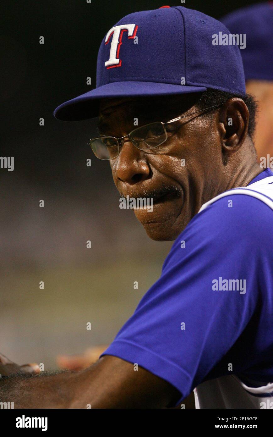 texas-rangers-manager-ron-washington-looks-out-from-the-dugout-as-his-team-gives-up-three-runs-to-the-milwaukee-brewers-in-the-sixth-inning-at-rangers-ballpark-in-arlington-texas-sunday