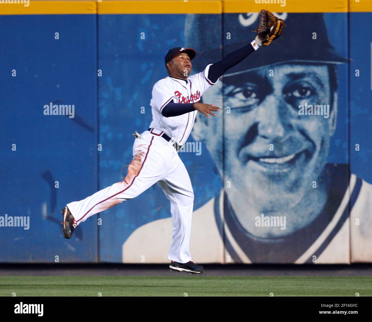 Atlanta Braves center fielder Andruw Jones make a leaping catch to