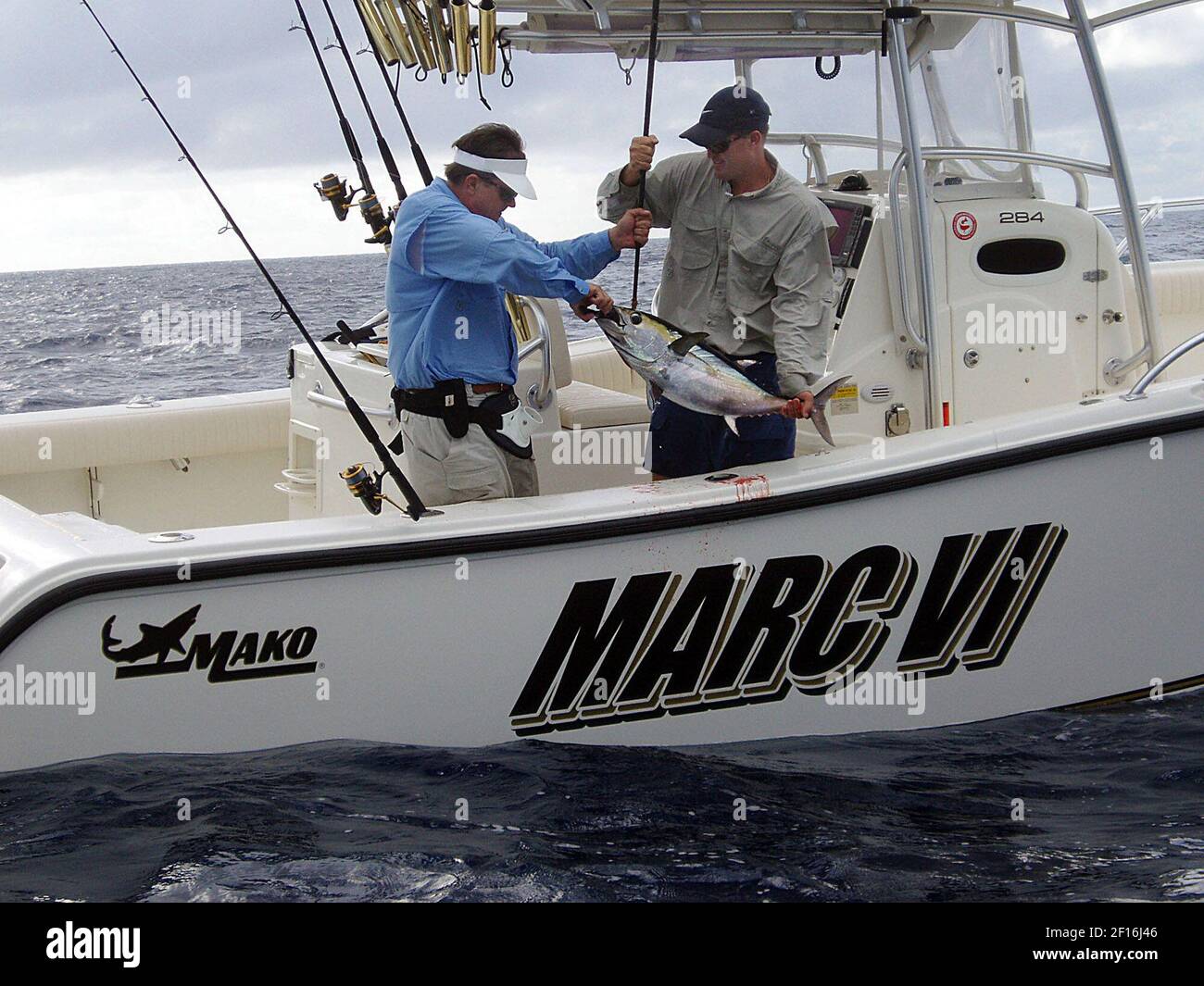 George Poveromo (left) and captain Brian Cone with a blackfin tuna they  caught on the Hump off Islamorada, Florida, aboard Poveromo's boat, Marc VI,  while filming George Poveromo's World of Saltwater Fishing