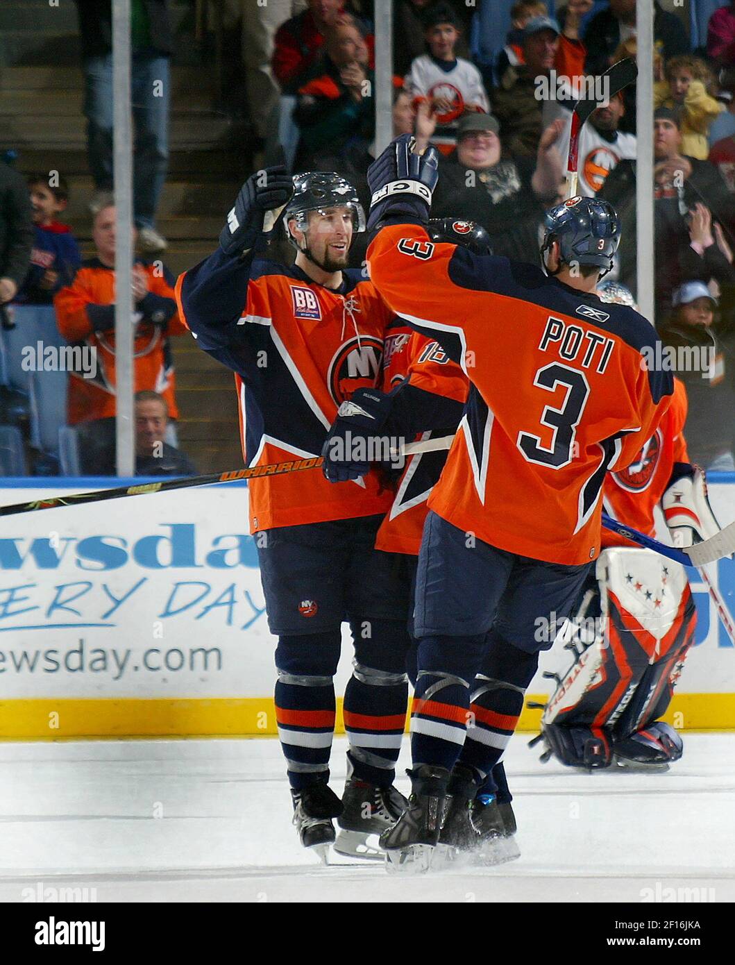 New York Islanders' Trent Hunter celebrates a shorthanded empty net ...