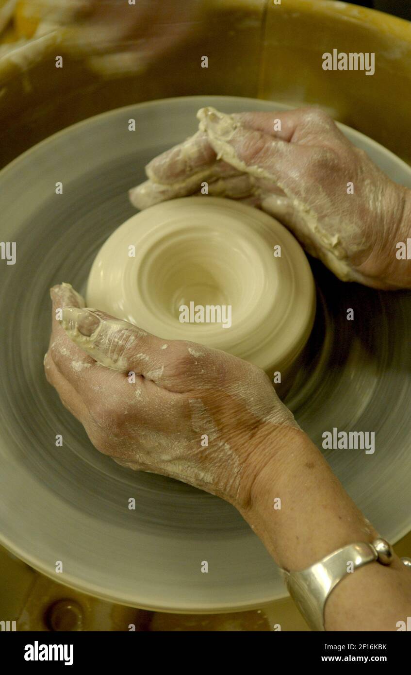 Reporter Mary Daniels attempts to make a pot on the pottery wheel