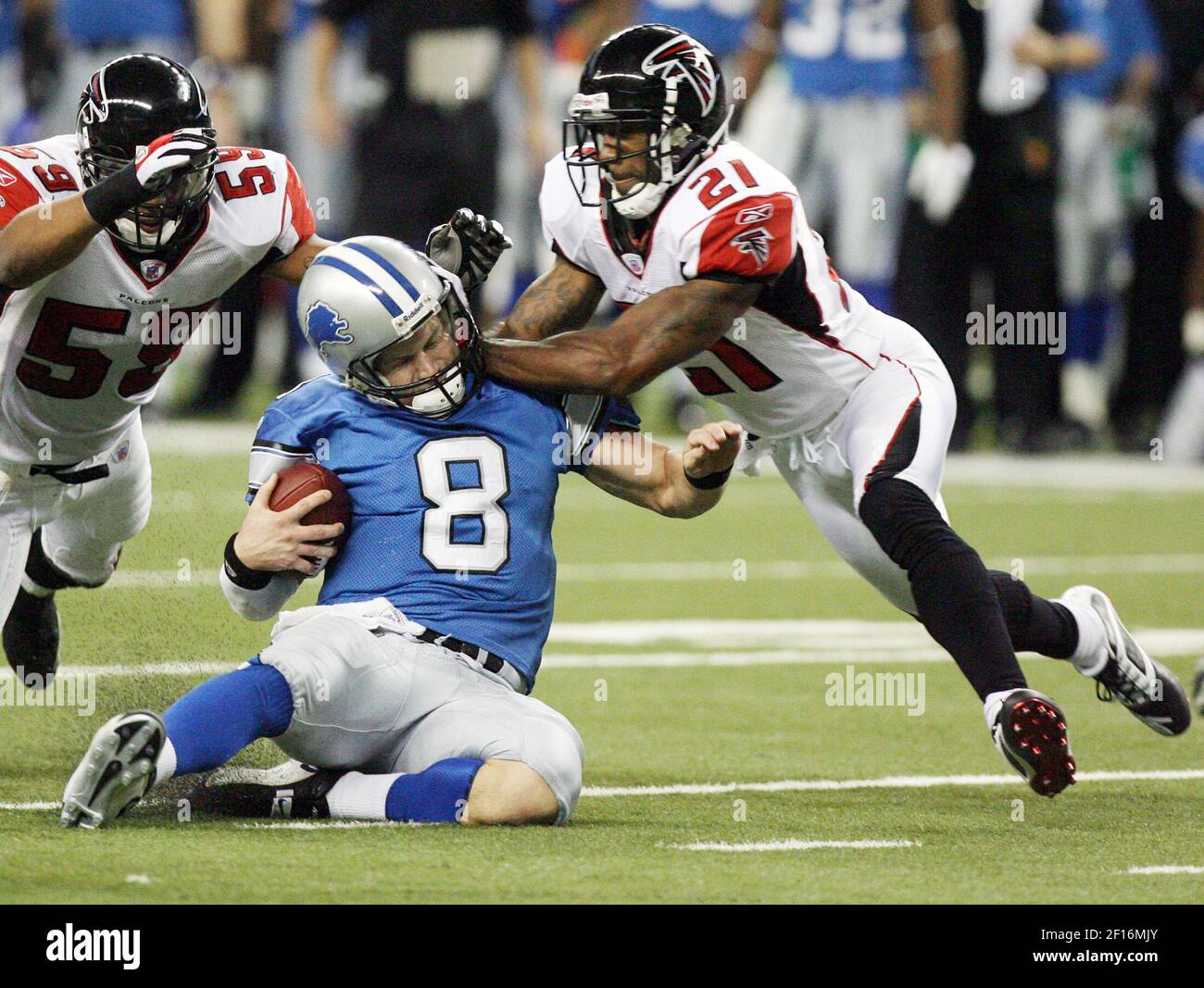 Detroit Lions quarterback Jon Kitna (8) gets hit by Atlanta Falcons  defender DeAngelo Hall (21) during the third quarter. Hall was called for a  personal foul and charged with a 15-yard penalty