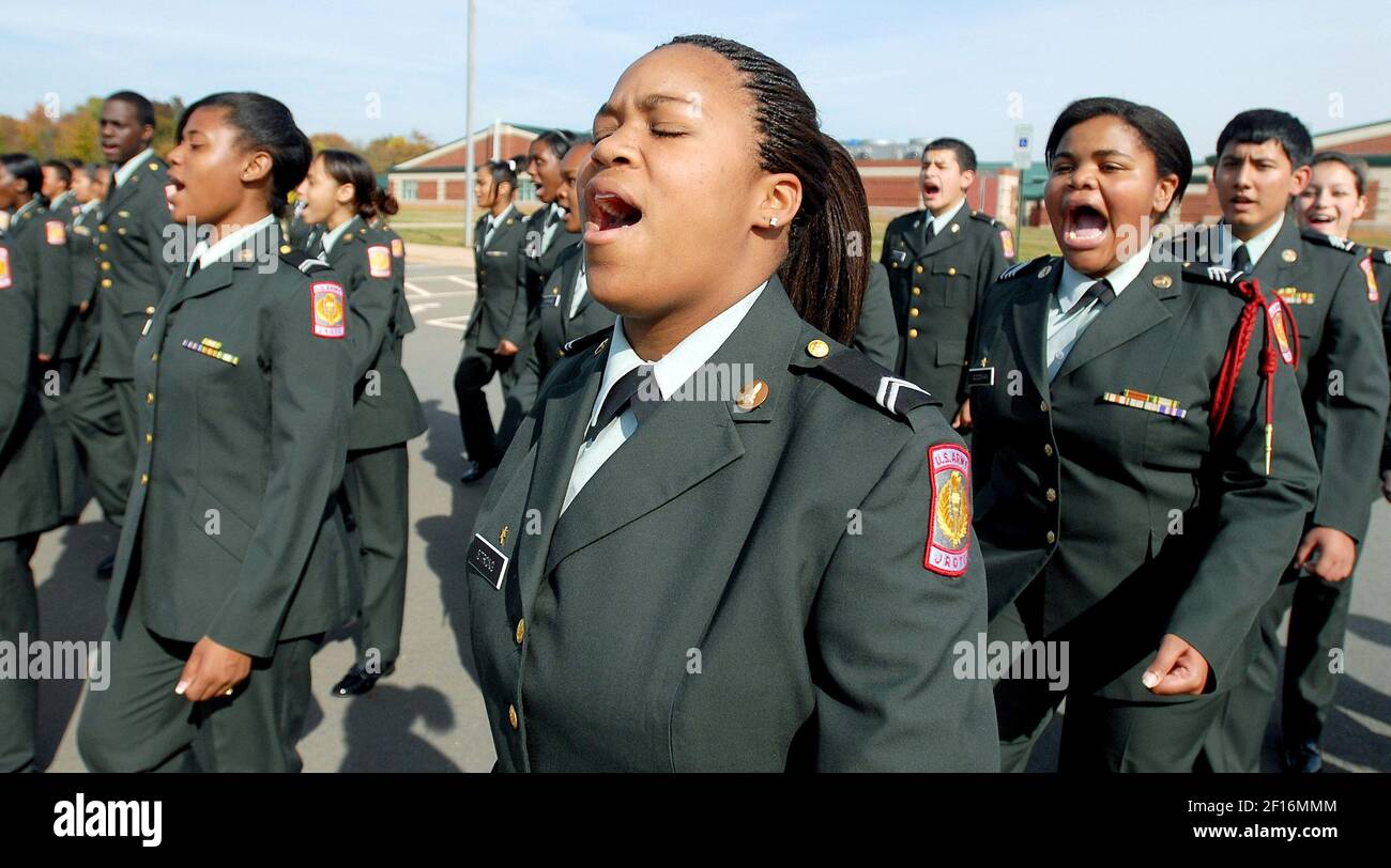 Ashley Stgrong (center) and other students call out a cadence during a  cadence and marching practice at a promotions and awards ceremony at E.E.  Waddell High School in Charlotte, North Carolina, Wednesday,