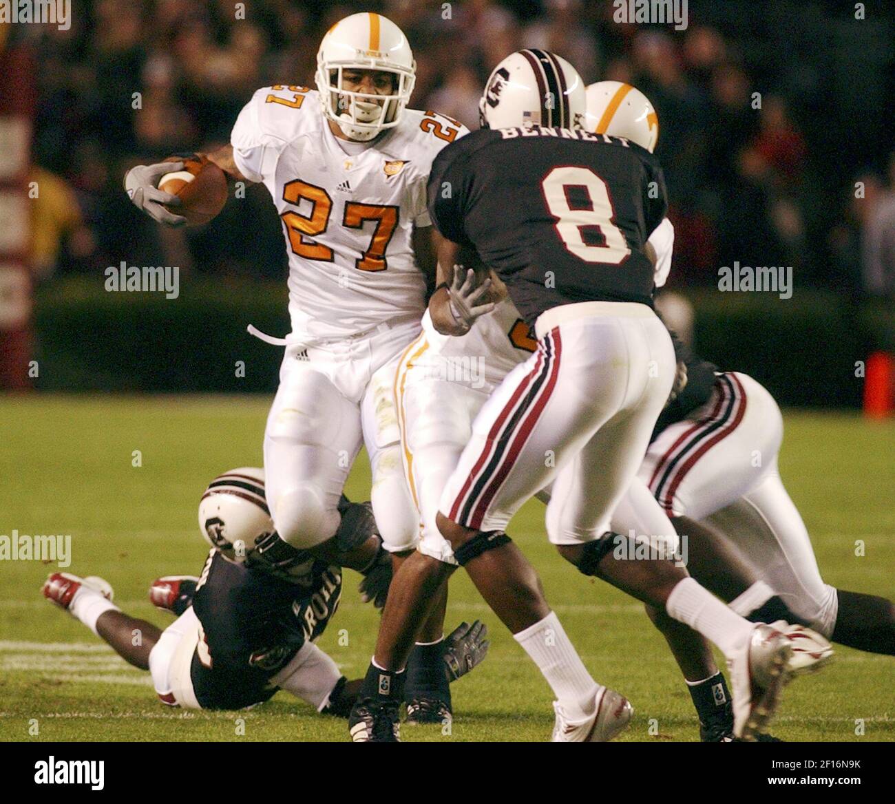 Tennessee tailback Arian Foster (27) rushes for a six-yard gain before  being tackled by University of South Carolina cornerback Fred Bennett in  the first quarter at Williams-Brice Stadium in Columbia, South Carolina,