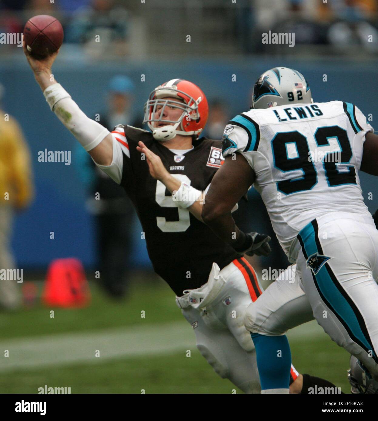 Cleveland Browns quarterback Charlie Frye throws under pressure from  Carolina Panthers' Damione Lewis in the third quarter. The Panthers  defeated the Browns, 20-12, at Bank of America Stadium in Charlotte, North  Carolina