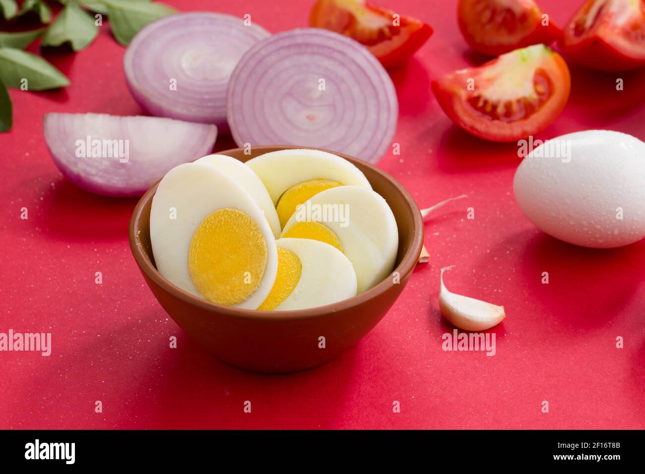 Egg masala raw cooking ingrediants,onion ,tomato,curry leaves,garlic