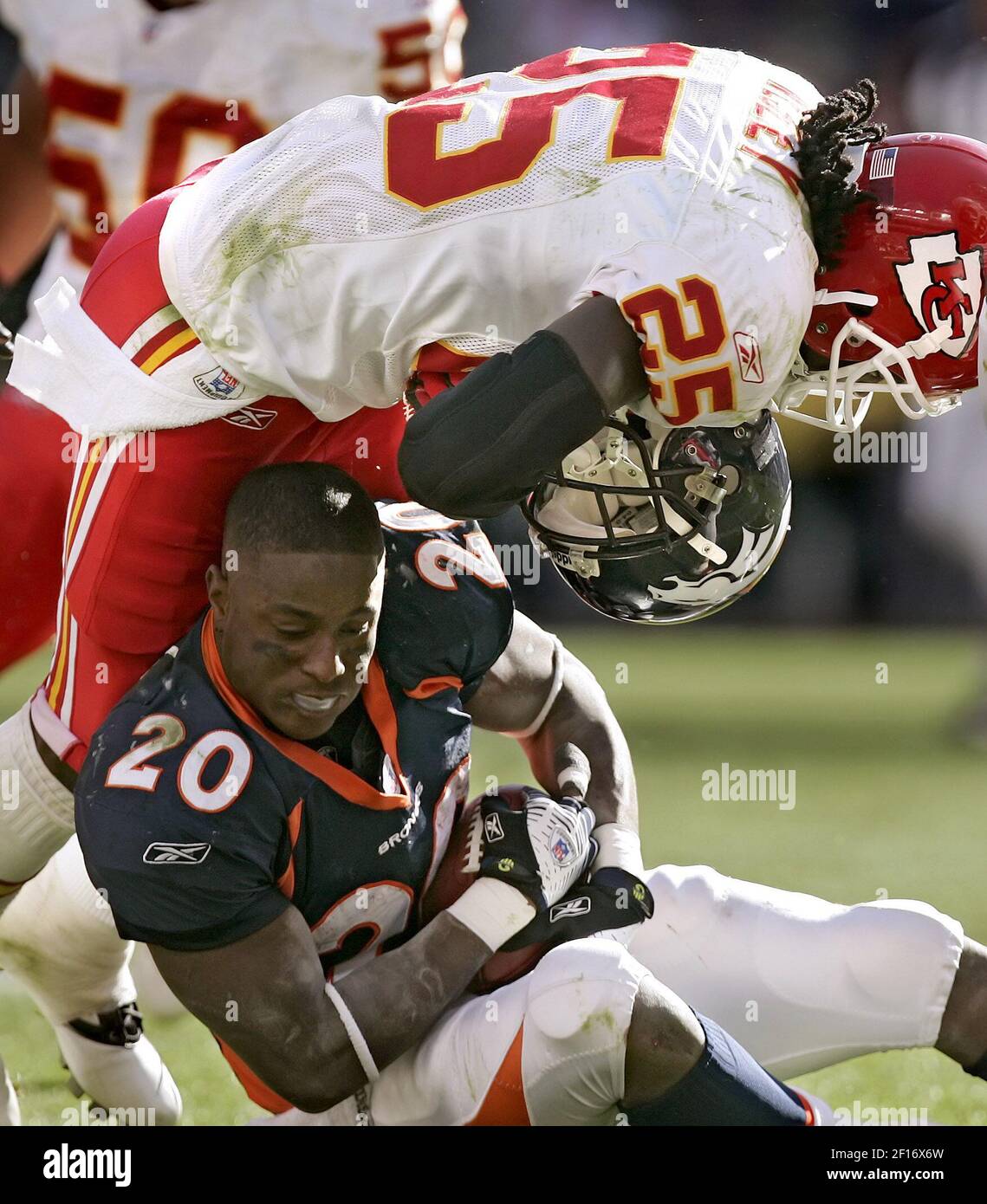 Kansas City Chiefs safety Greg Wesley tore the helmet off of Denver Broncos  running back Mike Bell in the fourth quarter at Invesco Field at Mile High  in Denver, Colorado, Sunday, September