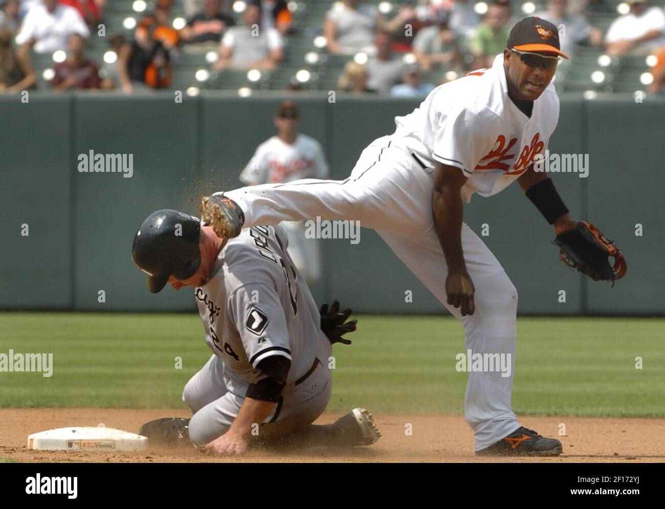 Chicago White Sox's Joe Crede, left, gets a cleat to the neck as Baltimore  Orioles' Miguel Tejada completes a double play that caught Crede and Ross  Gload out in the fifth inning