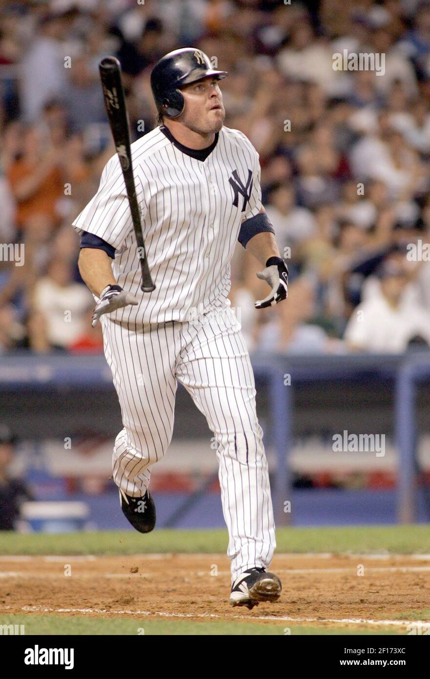 New York Yankees' Jason Giambi lets his bat go as he watches his