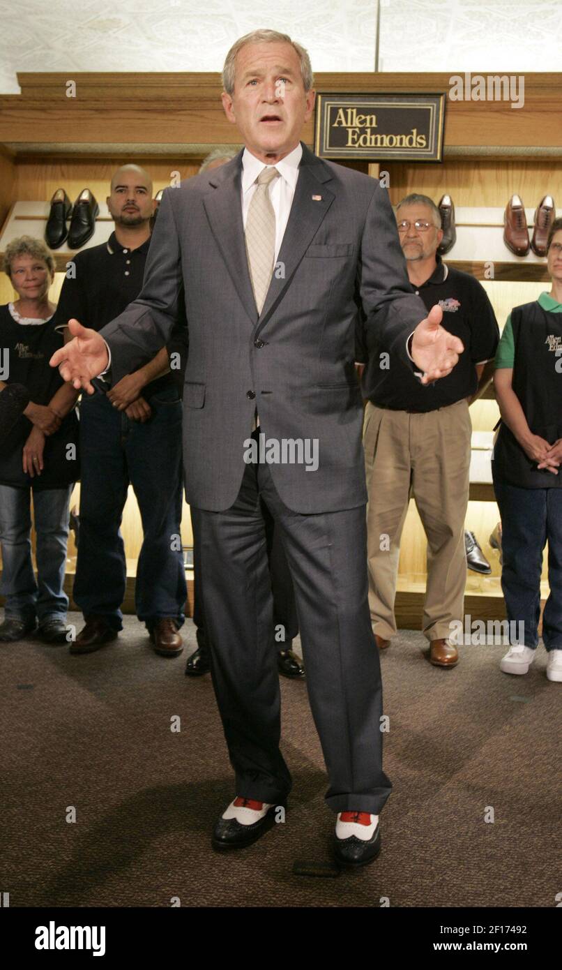 President George W. Bush sports his new red, white and blue shoes presented to him during his visit at Allen Edmonds, Port Washington, Tuesday, July 11, 2006. (Photo by Karen Sherlock/Milwaukee Journal Sentinel/MCT/Sipa USA) Stock Photo