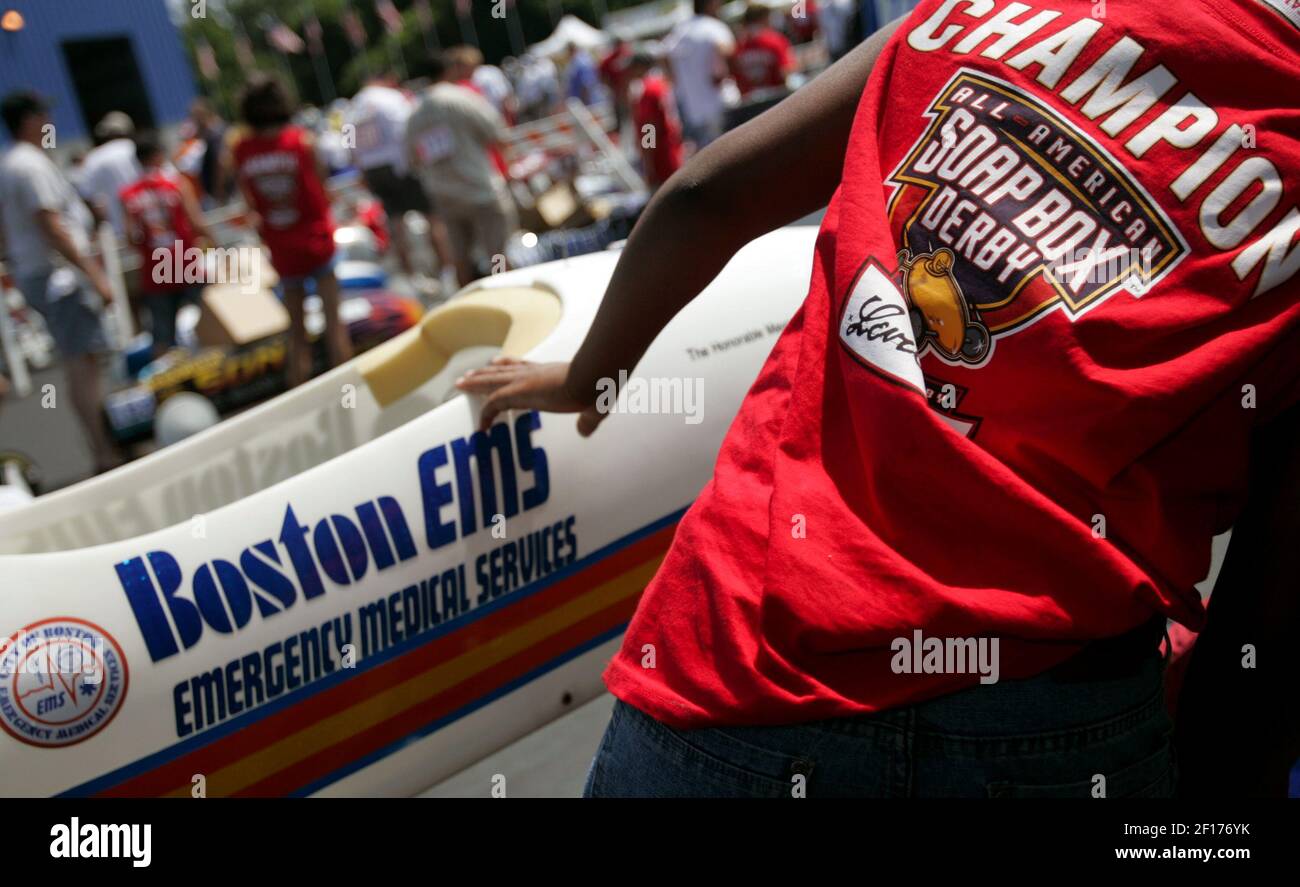 Mike Smith, 13, of Boston works on his superstock car on Thursday, July