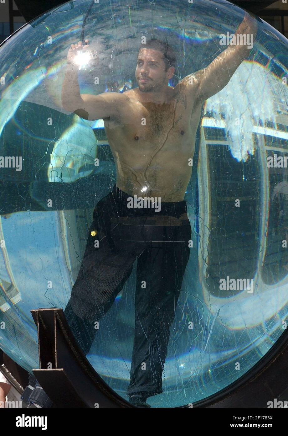 Performance artist and magician David Blaine begins his