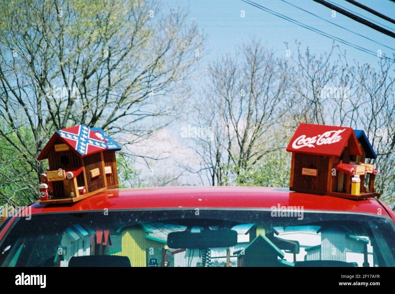 Homemade birdhouses for sale sit atop a car in Mountain View, Arkansas