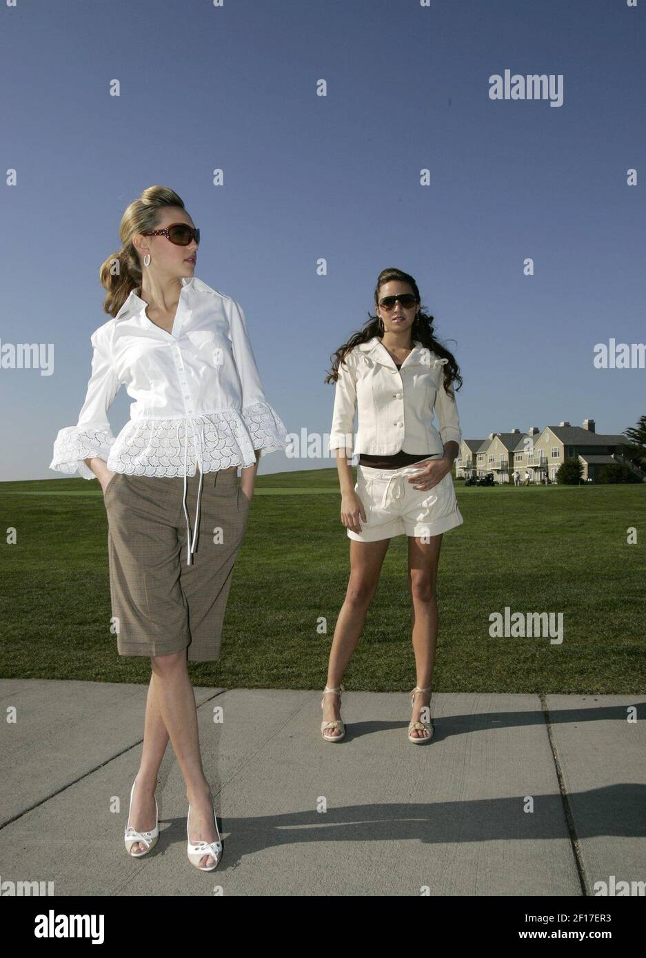 Model at left wears Leiko'' eyelet peplum blouse, $295, Anne Fontaine;  Poleci plaid long shorts,$118, Anthropologie; linen peep-toe pumps, $375,  Tod's; Versace sunglasses, $220, Bloomingdale's; Carolee faux pearl hoops,  $58, Macy's. At