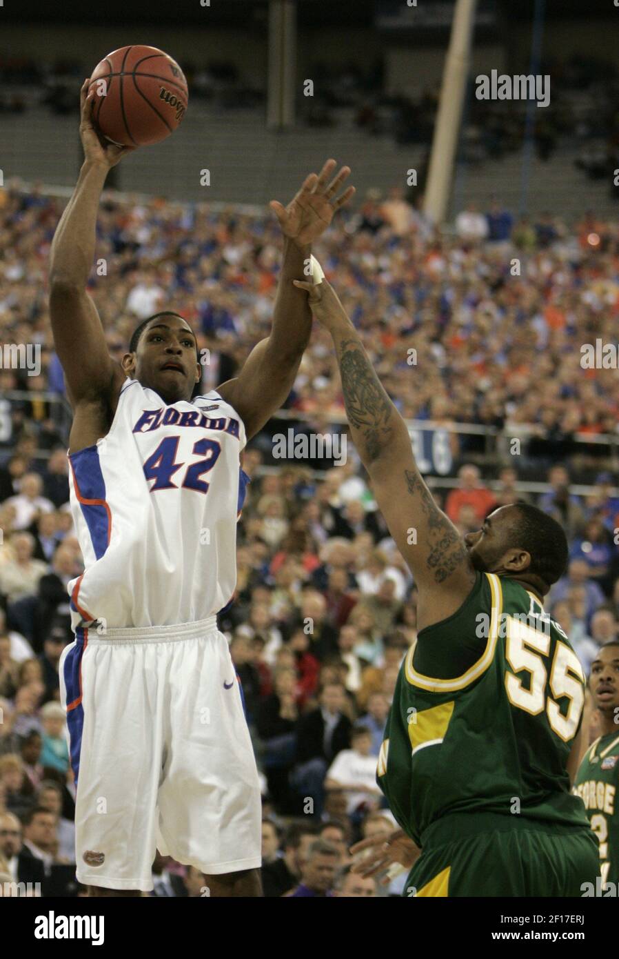 Florida's Al Horford shoots over George Mason's Jai Lewis in the first half of the first game in the Final Four Saturday, April 1, 2006 at the RCA Dome in Indianapolis, Indiana. (Photo by Mark Cornelison/Lexington Herald-Leader/KRT) Stock Photo