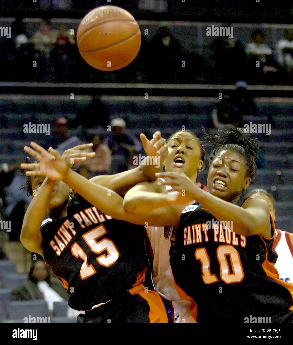 St. Paul's Rebecca Edmonds (15) and Nikki Bowen (10) squeeze