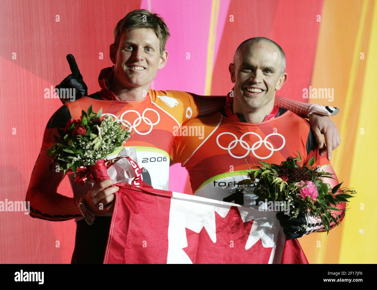 Jeff Pain of Canada, left, finished second and teammate Duff Gibson finished first at the Men's Skeleton on February 17, of the 2006 Winter Olympic Games in Cesana Pariol, Italy. (Photo by Barbara L. Johnston/KRT) Stock Photo