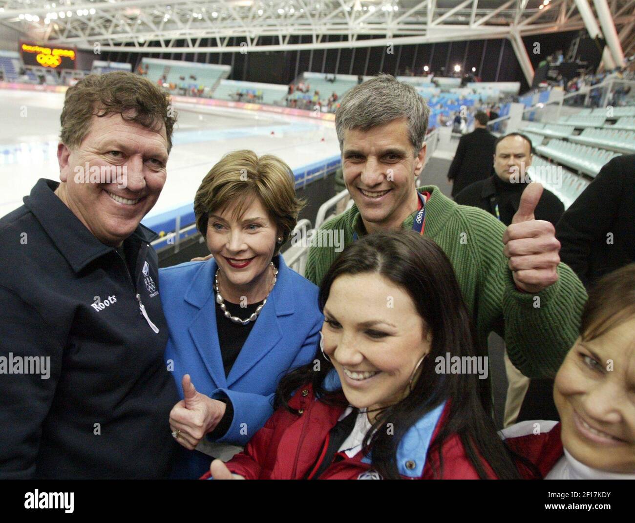 The family of U.S. Speedskater Chad Hedrick and First Lady Laura Bush celebrate his gold medal victory in the men's 5000m speed skating event at the Oval Lingotto venue on Saturday, February 11, 2006, during the 2006 Winter games in Turin, Italy. From left to right are Paul Hedric, Chad's father, Laura Bush, former olympic speedskater Eric Hyden and Chad's sister Natalie. (Photo by Ron Jenkins/Fort Worth Star-Telegram/KRT) Stock Photo
