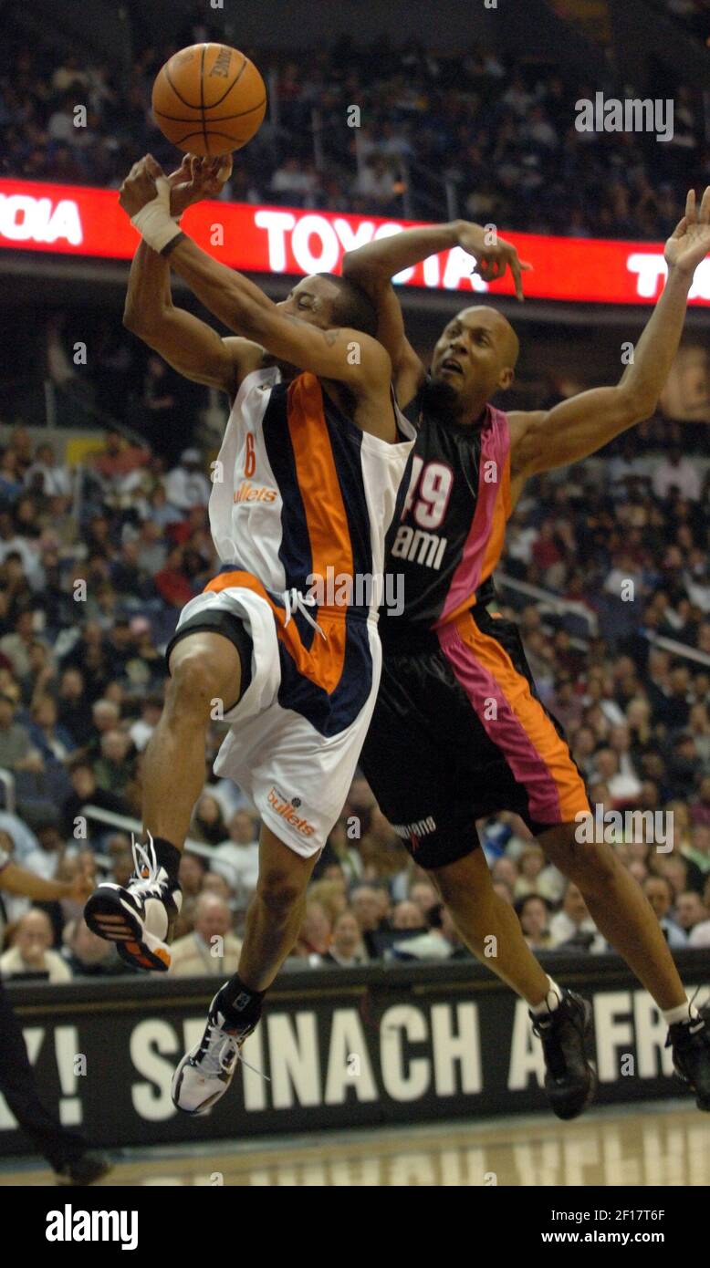 The Washington Wizards’ Antonio Daniels (6) is fouled by the Miami Heat