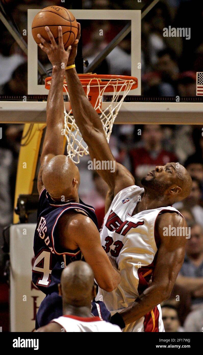 The Miami Heat's Alonzo Mourning blocks a shot by New Jersey Nets' Richard  Jefferson during second quarter action. The Nets defeated the Heat 95-88 at  AmericanAirlines Arena in Miami, Florida, Friday, December