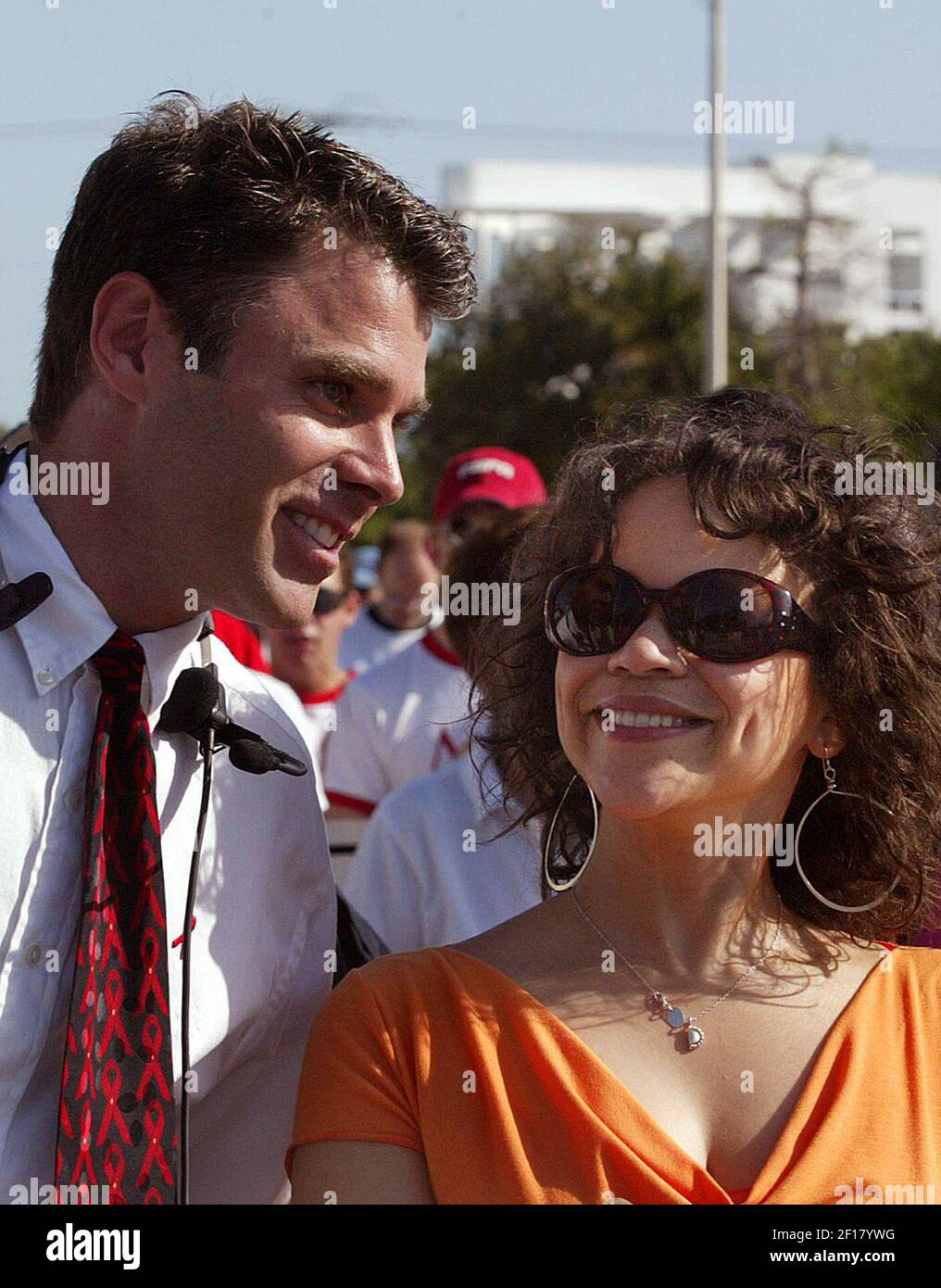 KRT LIFESTYLE STORY SLUGGED: NEWVOICES-ARNDT KRT PHOTOGRAPH BY CARL JUSTE/MIAMI HERALD (South Floirda Sun-Sentinel Out) (May 23) Chip Arndt (left) walks briefly with Grand Marshal actress Rosie Perez. Several hundred people participated in the AIDS Walk Miami which helped raise money to fight AIDS. Particpants were running, walking, and bladeing through a 3.1 mile route starting at the Miami Beach Convention Center. (Photo by jt) 2005 Stock Photo