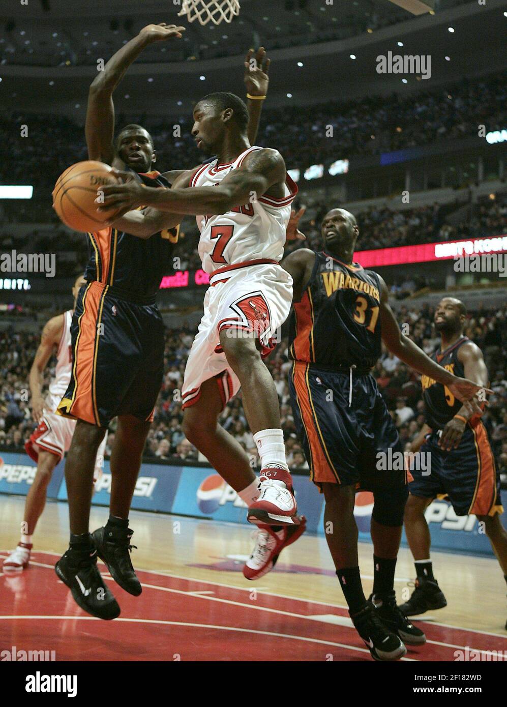 Chicago Bulls guard Ben Gordon (R) drives by New Jersey Nets guard Keyon  Dooling during the third quarter at the United Center in Chicago on April  4, 2009. The Bulls won 103-94. (
