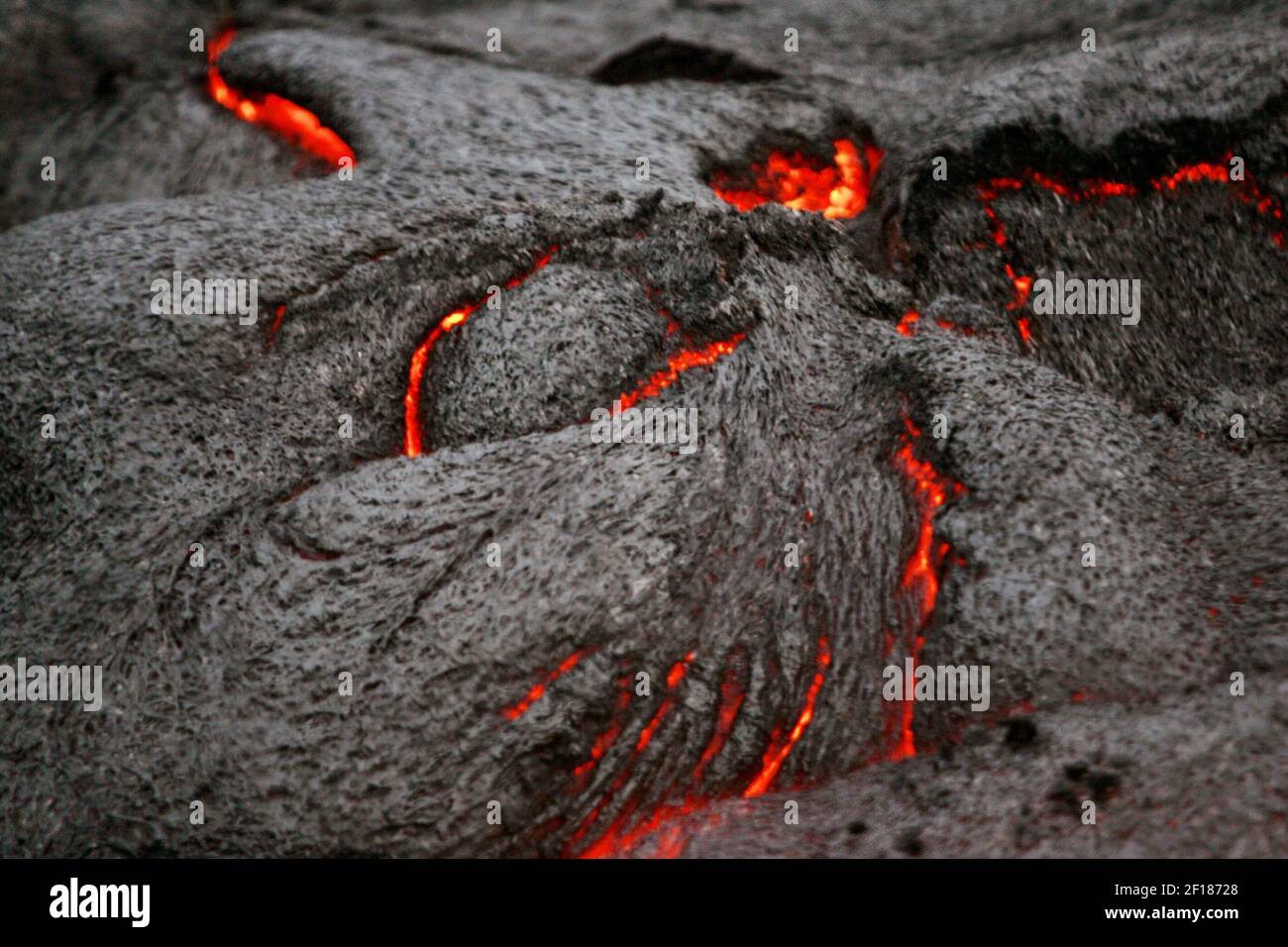 -- NO MAGS, NO SALES -- KRT TRAVEL STORY SLUGGED: UST-KILAUEA KRT PHOTOGRAPH BY LOUIS DeLUCA/DALLAS MORNING NEWS (May 2) A detail of one of the active lava areas almost looks like a menacing face at Kilauea, an active volcano on the big island of Hawai'i. The curious must brave a three-hour hike over past dried lava flows in order to see the new ones up close. (Photo by lde) 2005 Stock Photo