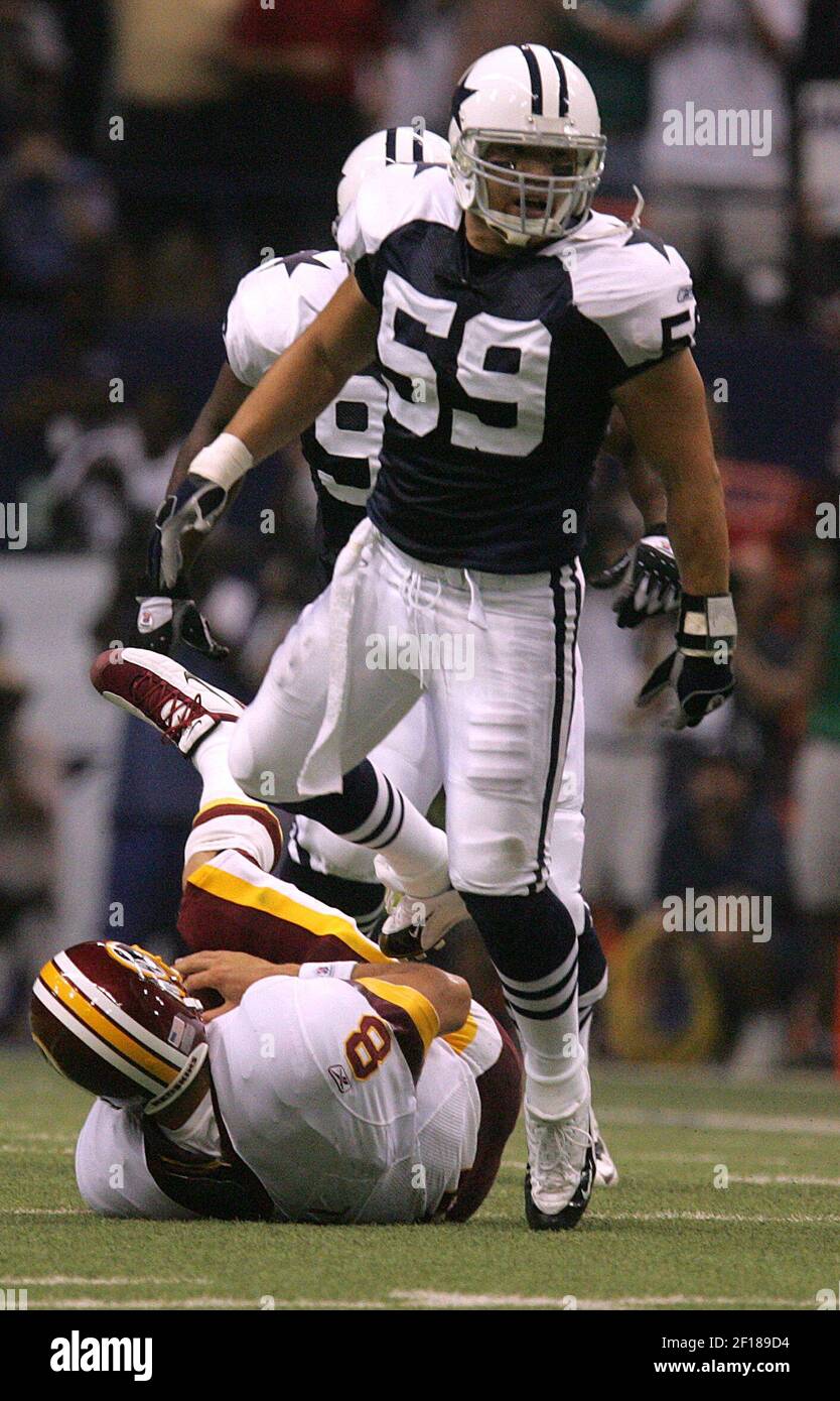 Dallas Cowboys linebacker Dat Nguyen celebrates after Seattle fumbled the  ball and Dallas recovered it on Monday night football against the Seattle  Seahawks at Quest field in Seattle, WA.