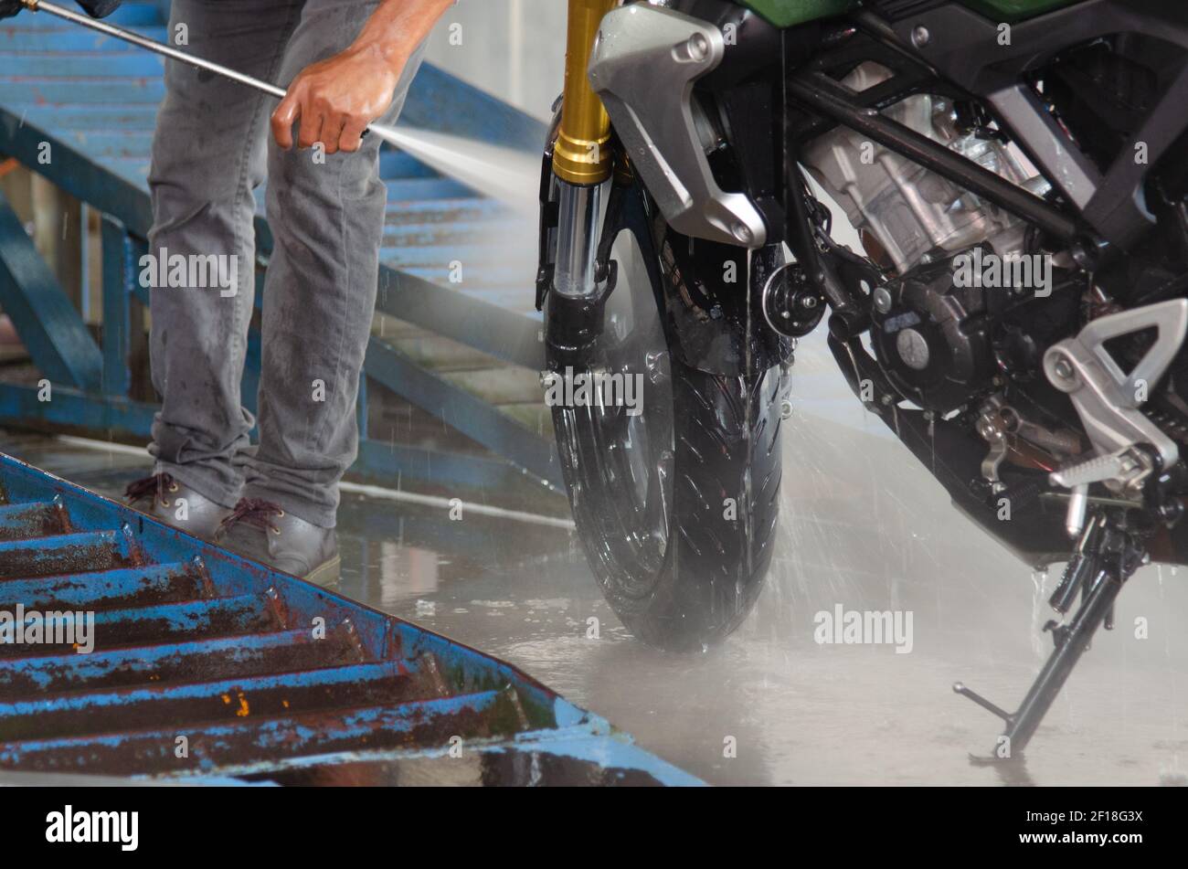 Clean up the motorcycle wash at the car wash shop Stock Photo - Alamy
