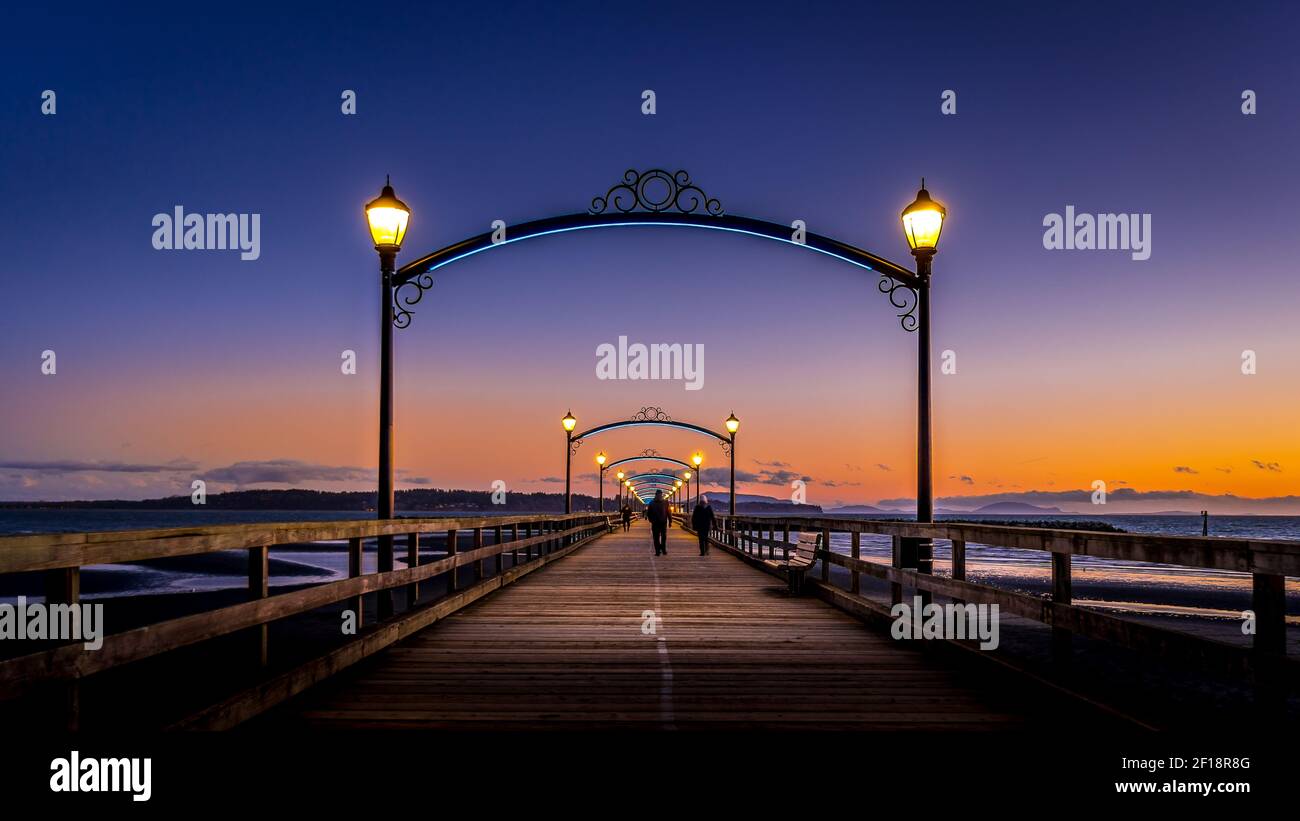 Blue Hour over Canada's Longest Pier in Semiahmoo Bay at the village of White Rock in British Columbia, Canada Stock Photo