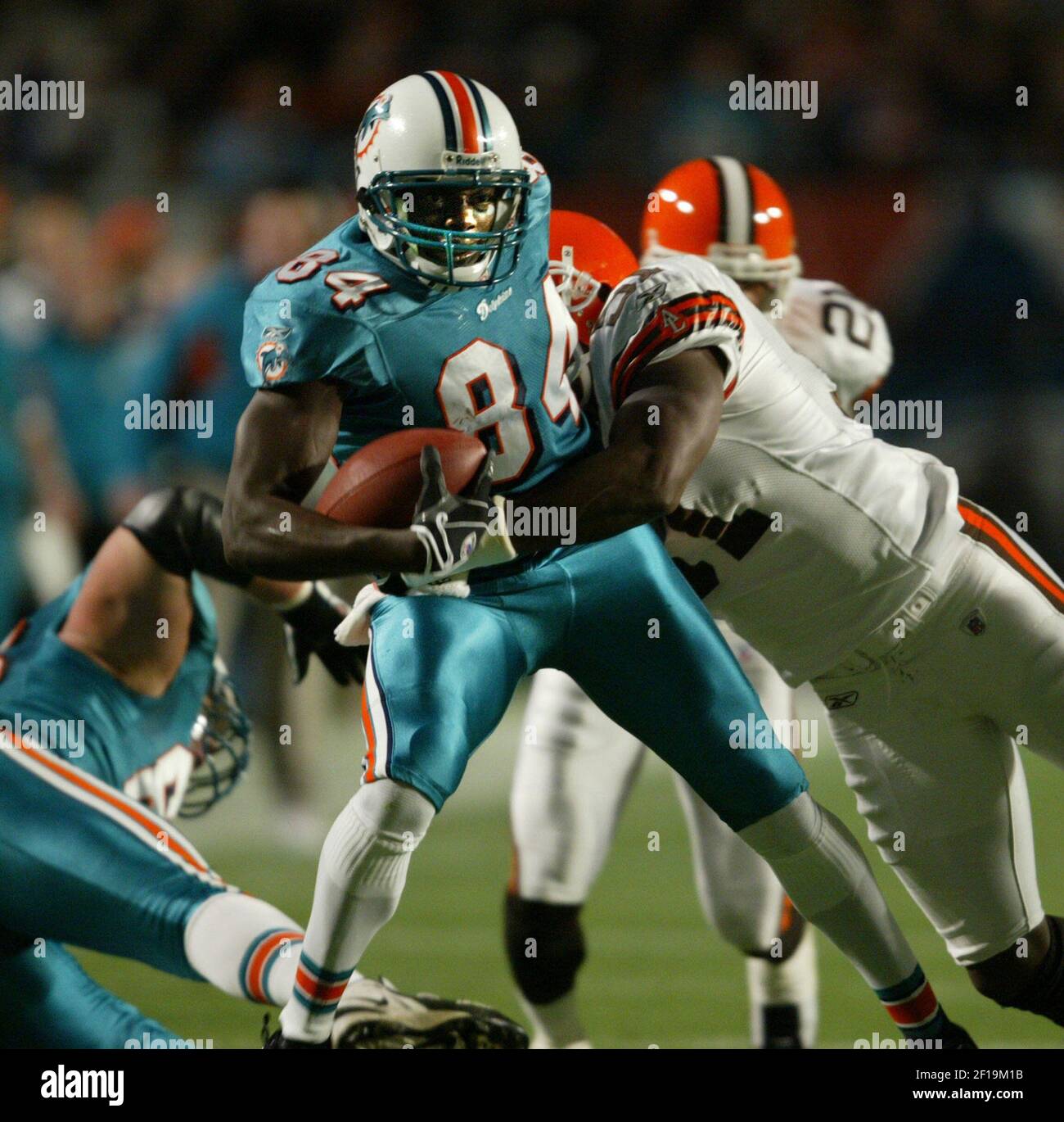 Miami Dolphins wide receiver Chris Chambers (84) against New England  Patriots saftey Rodney Harrison (37) in action at Pro Player stadium in  Miami, Fl. The New England Patriots beat the Miami Dolphins in overtime  19-13. October 19, 2003. (UPI/Susan