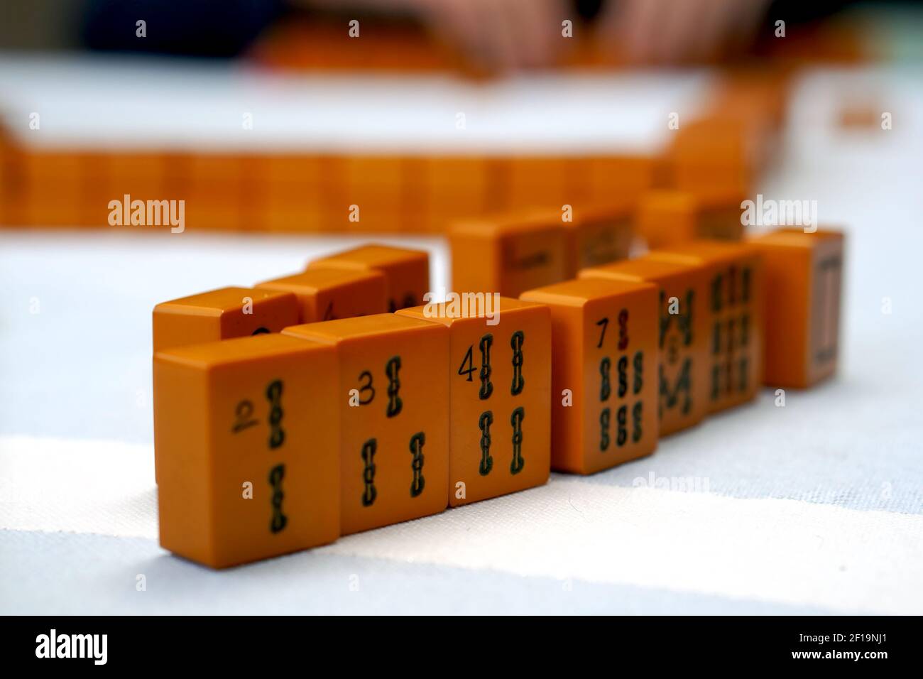Old Mah Jongg tiles on a table Stock Photo