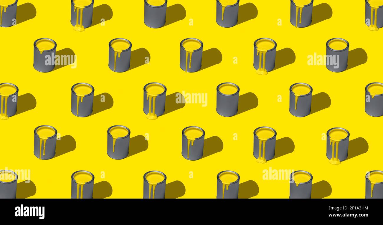 Paint can with illuminating yellow paint, aligned symmetrically in a