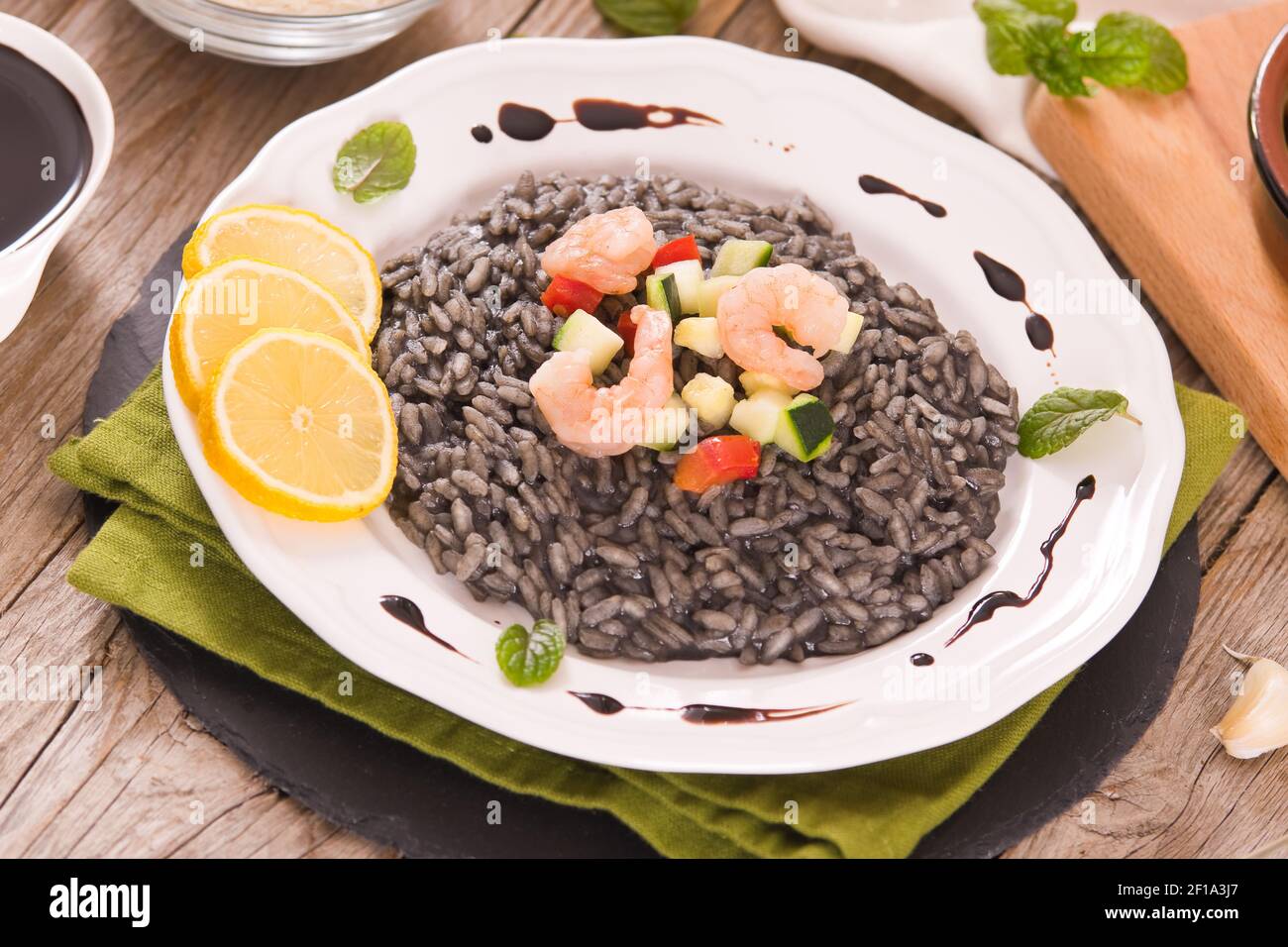 Squid ink risotto Stock Photo - Alamy