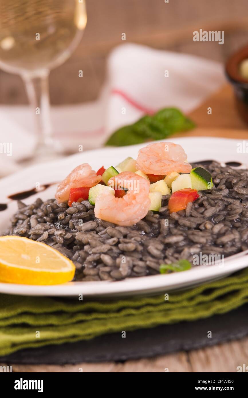Squid ink risotto Stock Photo - Alamy