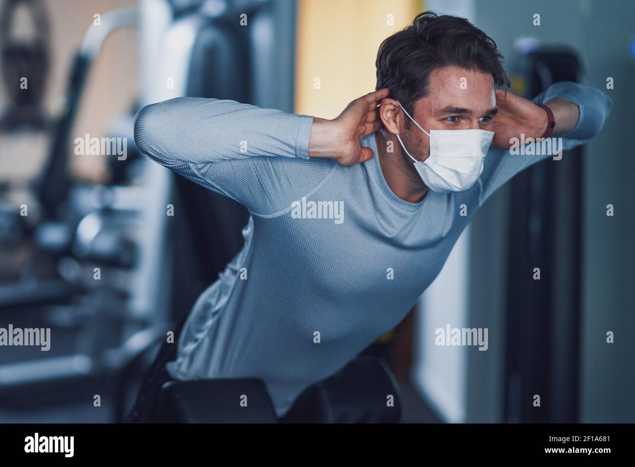 Wearing mask working young hi-res stock photography and images - Alamy