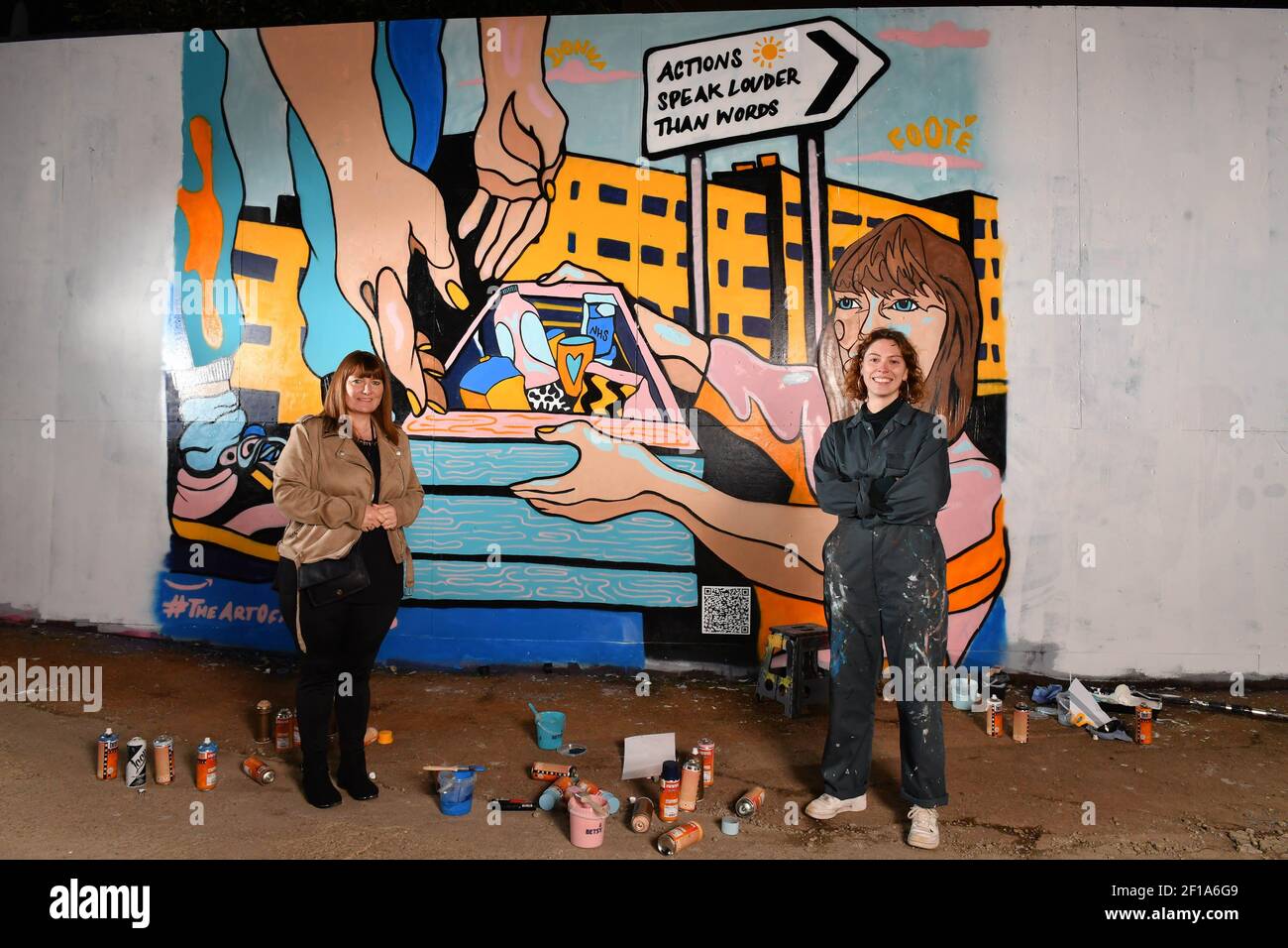 EDITORIAL USE ONLY Donna Foote with artist Molly Hankinson and her mural of Donna Foote, which has been created as part of the #TheArtOfMotherhood series by Amazon Handmade marking MotherÕs Day, to celebrate her efforts in caring for her local community during the pandemic, at Riverside, Glasgow. Stock Photo