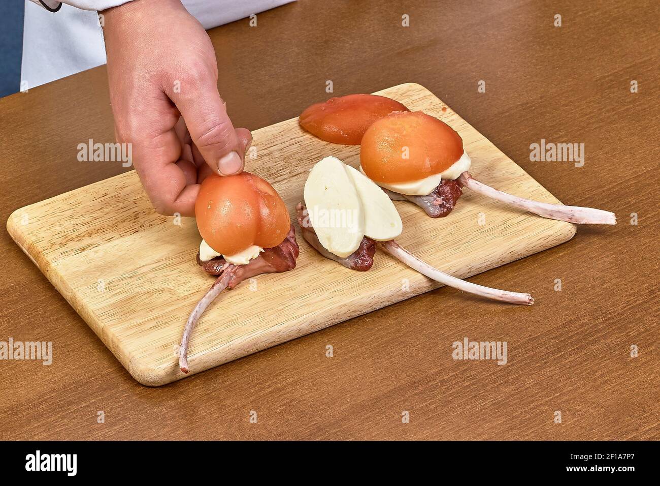 Cook prepares lamb ribs cooking process Stock Photo - Alamy