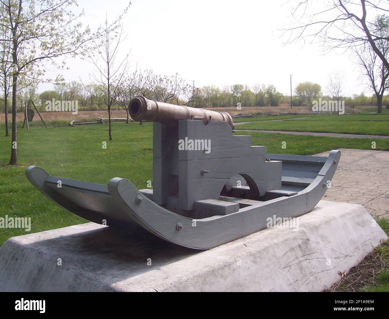 A British cannon sits behind he River Raisin Battlefield Vistor Center ...