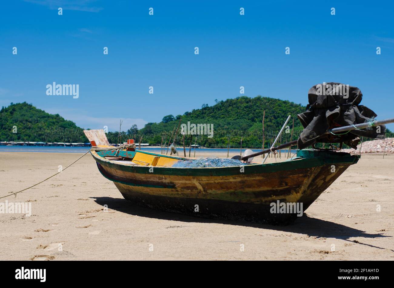 Wood Fishing Boat is Moored on the Beach Stock Photo - Alamy