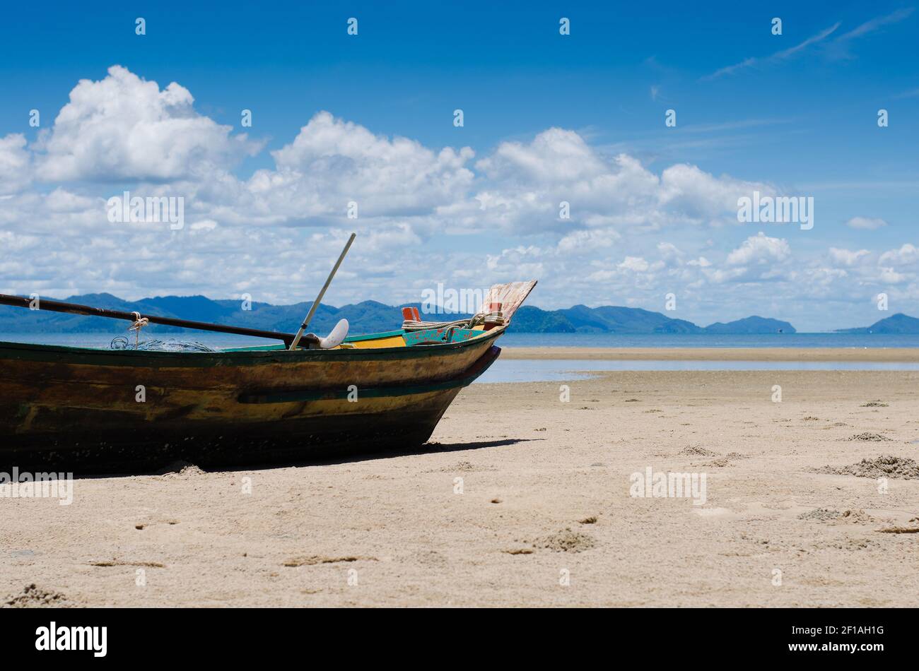 Wood Fishing Boat is Moored on the Beach Stock Photo - Alamy