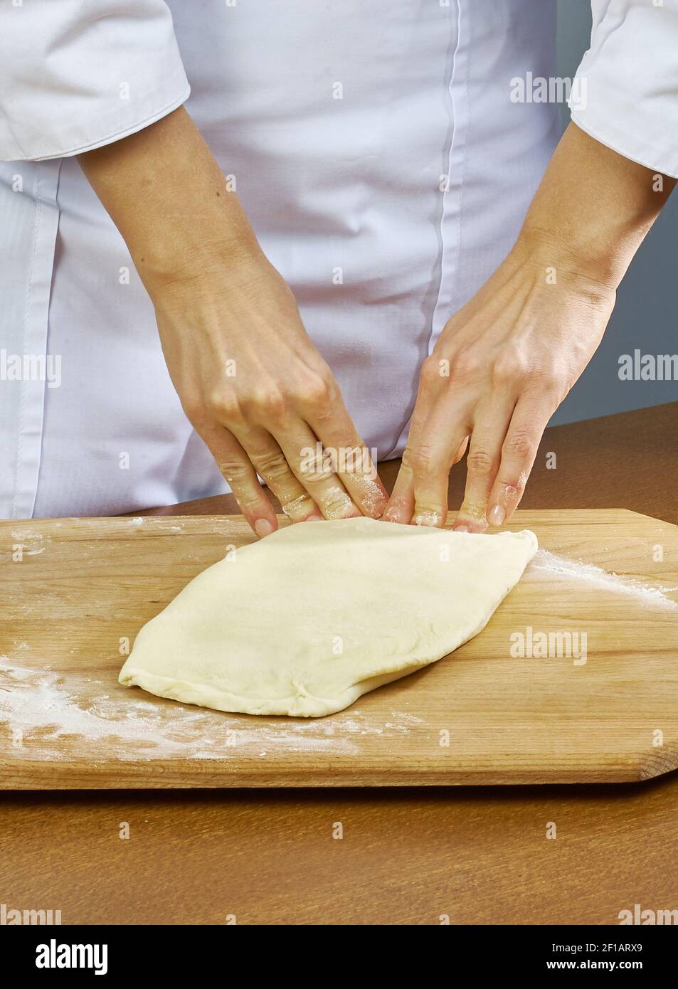 Woman rolls squeezes dough Handmade Series Food recipes Stock Photo