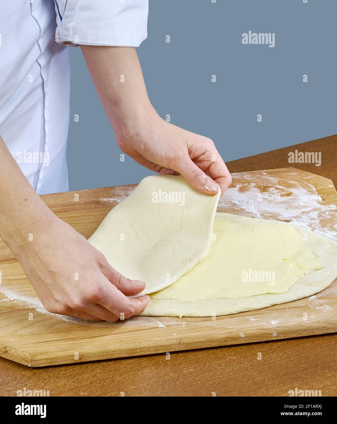 Woman rolls squeezes dough Handmade Series Food recipes Stock Photo