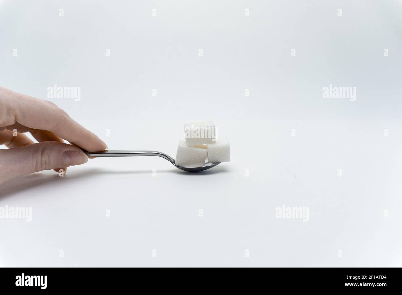 sugar cubes per teaspoon calories sweets ingredient Stock Photo Alamy