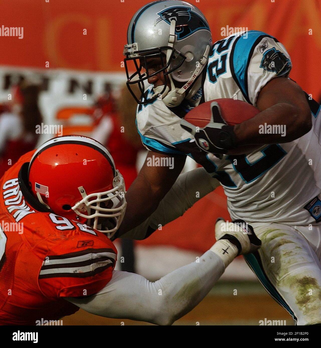 KRT SPORTS STORY SLUGGED: PANTHERS-RAMS KRT PHOTOGRAPH BY PHIL  MASTURZO/AKRON BEACON JOURNAL (December 1) CLEVELAND, OH -- Cleveland Browns  quarterback Tim Couch is taken down by Carolina Panthers Julius Peppers  during their