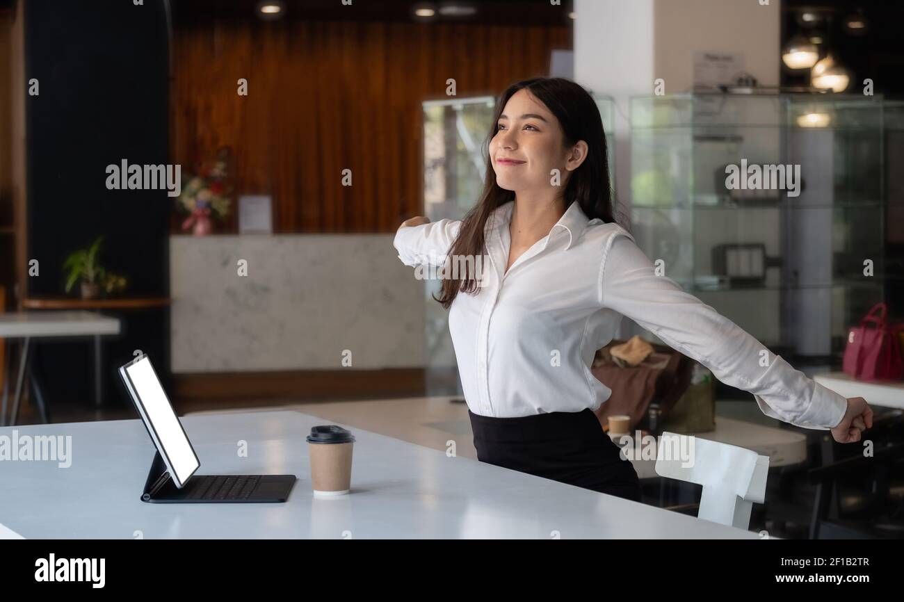Beautiful Asian Businesswoman having break and resting after solving task Relax from work Stock Photo