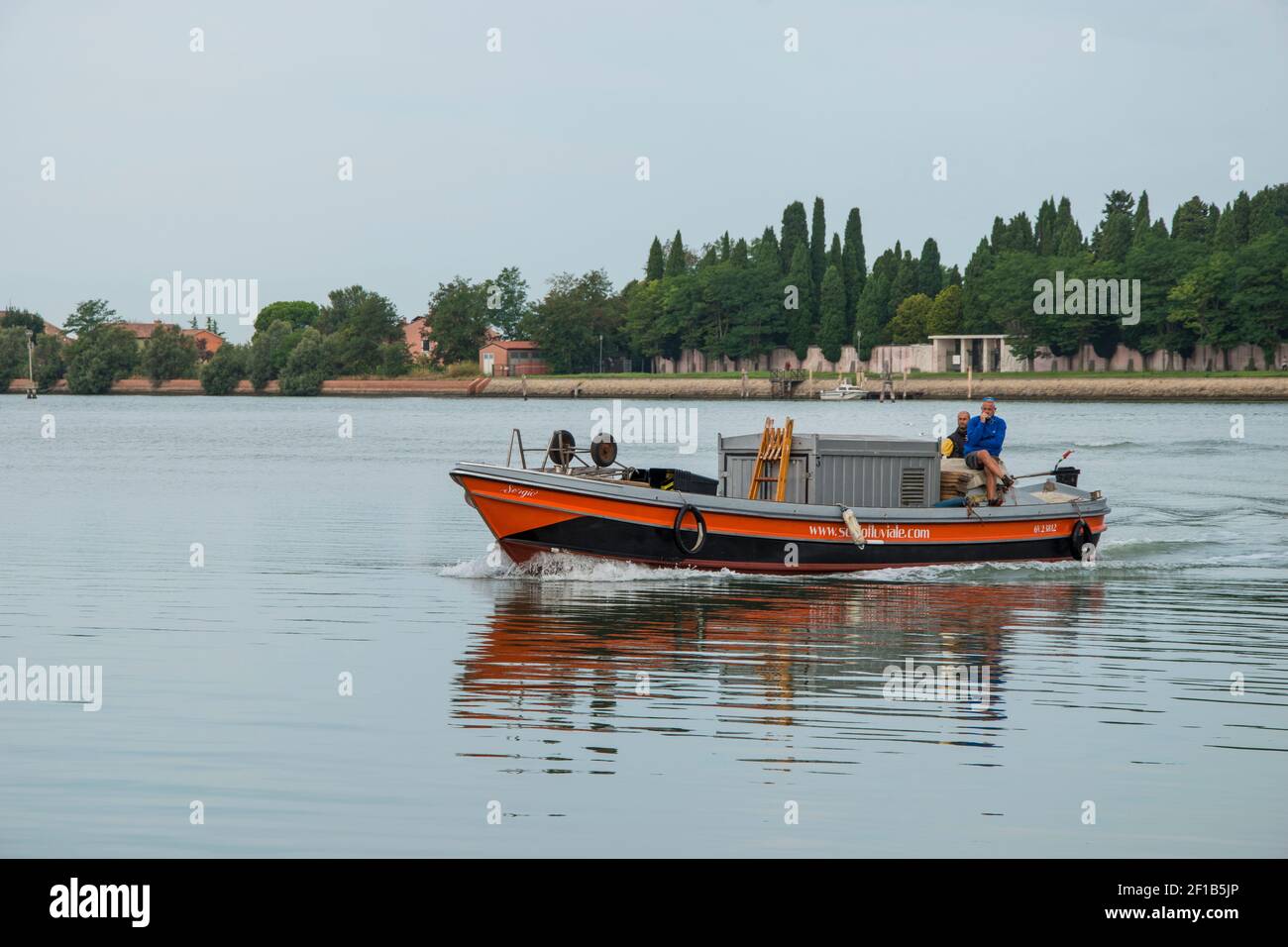 Cargo boat for trade in the canals of the city of Venice, Italy, Europe. Stock Photo
