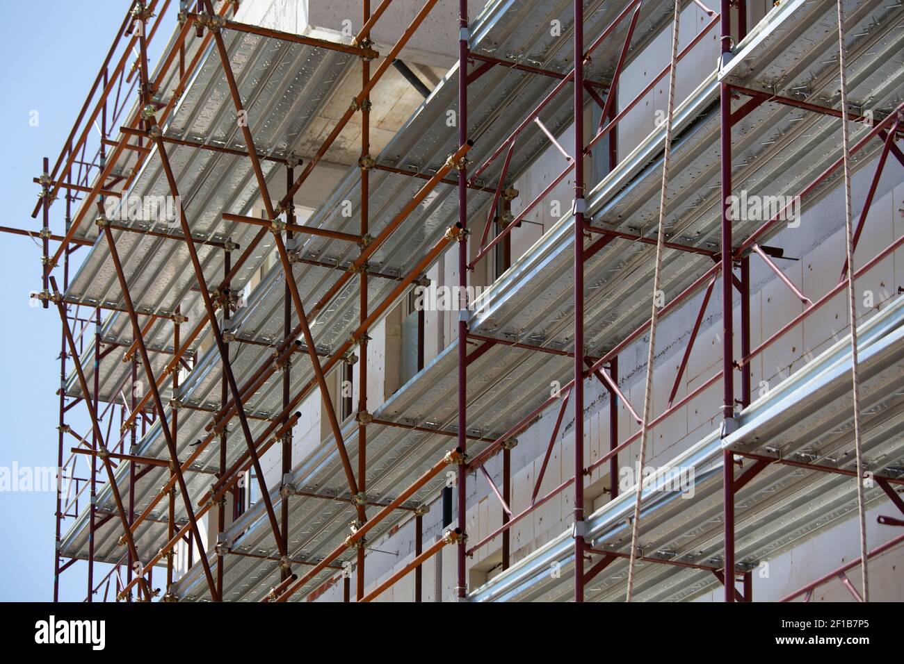 Construction of a building using scaffolding  Stock Photo